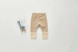 Infant striped cotton leggings detail view, showing soft ribbed cuffs and neat stitching.