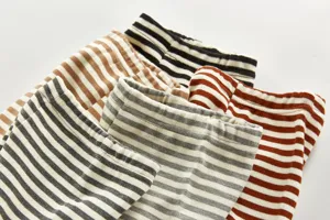 Infant striped long pants detail view, soft cotton material, comfortable elastic waistband.