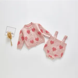Cute baby knit cardigan and strap rompers set with pink heart pattern for infant girls.