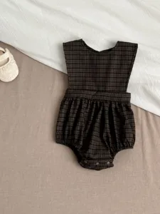 Infant baby girl plaid sleeveless romper dress detail, cute brown checkered infant creeper outfit.