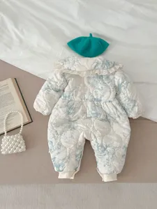 Detail of baby thick warm romper featuring elegant lace collar and blue floral quilted design.