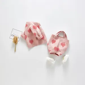 Cute baby knit cardigan and romper set, adorable pink heart pattern infant clothing.