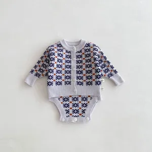 Details of baby knit cardigan romper set with retro geometric pattern in grey, soft fabric.