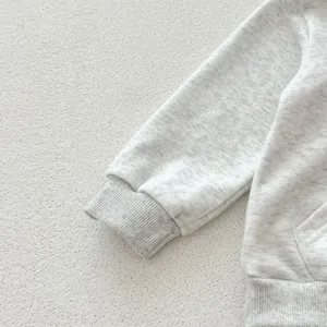 Close-up detail view of infant grey heather hoodie sleeve featuring ribbed cuff design.