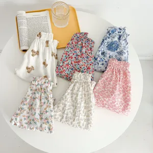 Detailed view of summer baby pants featuring cute floral and bear prints with elastic waist.