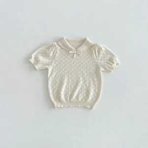 Detail view of a Korean-style baby knit short-sleeve top with a sweet polo collar and bow.