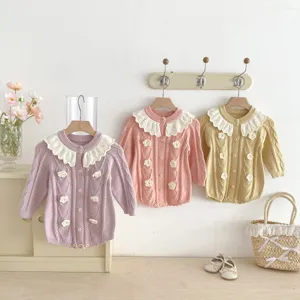 Infant baby knitted romper detail featuring cute lotus leaf collar and hand-crocheted 3d flowers.