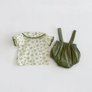 Baby summer clothing set, floral short sleeve blouse and green suspender shorts outfit.