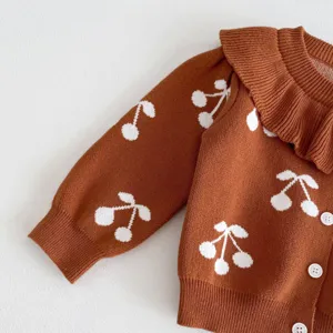 Baby girls brown knit cardigan detail, cute white cherry pattern, large collar and front buttons.