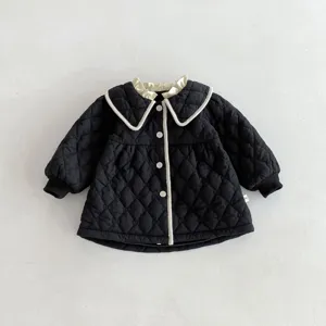 Details of black quilted baby toddler coat with chic white collar and buttons for winter season
