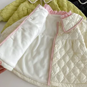 Kids quilted winter jacket detail, plush lining, sweet pink ruffle collar, cozy toddler outerwear.