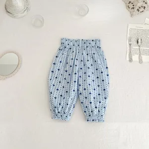 Cute baby mosquito pants featuring light blue fabric with dark blue heart patterns.