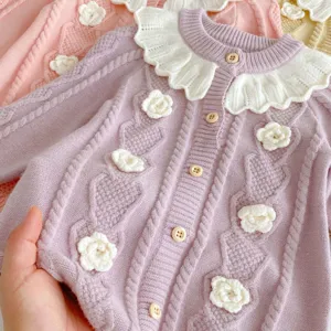 Infant baby girl knit cardigan detail, long sleeve thermal romper with cute floral design.
