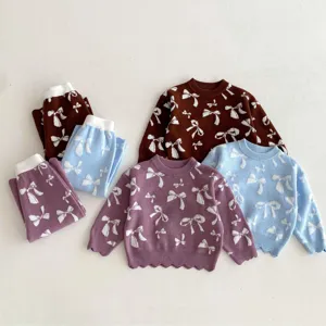 Cute toddler girls knitwear set featuring long sleeve sweater and pants with bow jacquard.