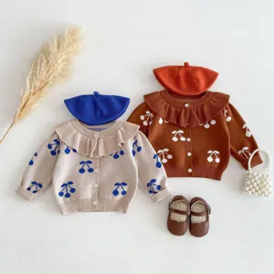 Infant baby girls knitted cardigan sweater detailed view, cherry pattern, sweet lapel design.