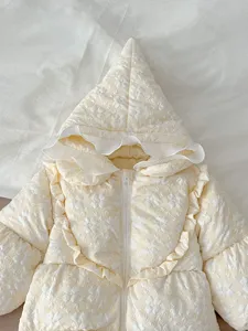 Infant winter quilted baby down jacket detail featuring floral pattern and cute pointy hood.