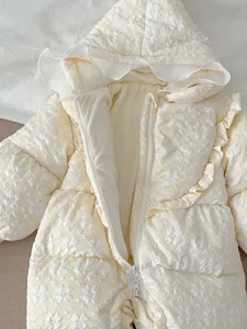 Infant floral quilted down jumpsuit detail, warm cream winter baby snowsuit close-up