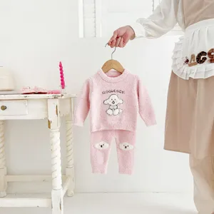 Pink fuzzy baby pajama set with cute dog graphic, soft fleece two-piece loungewear.
