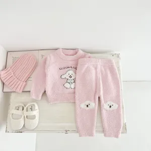 Cute pink fuzzy baby sweater and pants set detail, soft half-fleece winter homewear outfit.