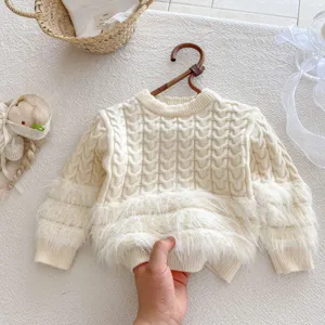 Infant cable knit sweater detail, cozy fluffy plush hem and sleeves, warm baby winter clothing.