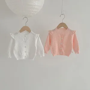 Girl knit cardigan detail view, cute ruffle shoulder design, breathable spring baby sweater.