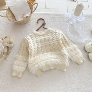 Infant knitted sweater detail view, cozy cream cable knit plush contrast baby winter top.