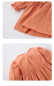 Détail de robe unie brodée à manches longues pour filles, style doux et confortable.