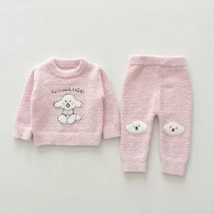 Infant pink fluffy fleece pajama set detail, cute puppy knit pattern, cozy toddler homewear