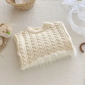 Cute baby knitted sweater detail, cream cable knit texture with fluffy hem trim.