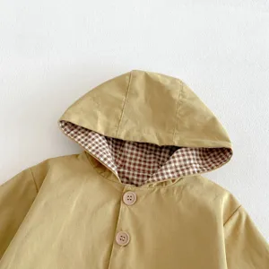 Baby toddler hooded windbreaker jacket detail view, khaki cotton shell with cute brown plaid lining.