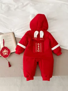 Baby red winter romper detail, thick plush rabbit ears hood, cute festive new year style.