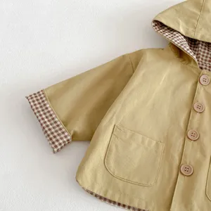 Baby hooded windbreaker detail shot, cute casual toddler jacket with plaid lining.