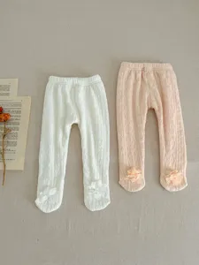 Infant winter fleece-lined tights with cute footed design and adorable flower ankle details.