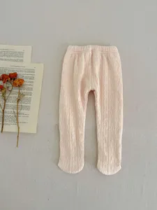 Baby pink knitted footed tights for toddlers, warm winter thermal leggings with cute texture.