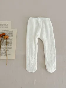 Cozy baby winter fleece lined footed tights detail, soft knit fabric with cable pattern.