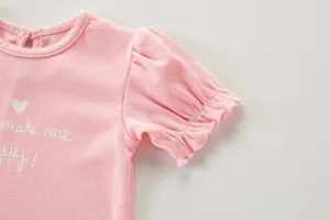 Camiseta rosa de canalé para niña con mangas cortas abullonadas y bonito estampado.