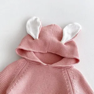 Baby pink knitted sweater hoodie with cute white bunny ears, soft infant autumn top detail.