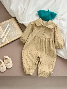 Detailed shot of baby corduroy floral romper with doll collar for spring and autumn seasons.