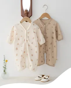 Cute floral baby romper in waffle knit fabric, long sleeve infant bodysuit for spring.