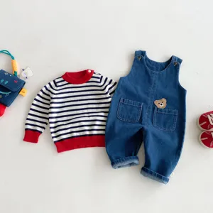 Cute infant baby denim overalls and striped sweater set with bear patch, comfortable for toddlers.
