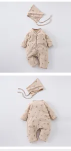 Waffle knit baby romper detail, cute print texture, soft infant clothing close-up view
