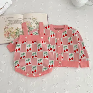 Baby knitted cardigan sweater and strap romper set with pink cherry jacquard pattern for girls.