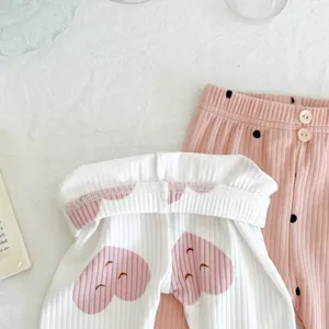Infant ribbed cotton leggings set, cute heart print detail for baby girls autumn wear.