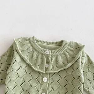 Baby light green knit cardigan, large ruffle collar, hollow knit long sleeve detail view.