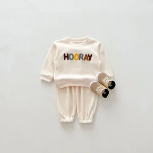 Infant baby long sleeve sweater pants set detail shot, cute letter embroidery on chest.