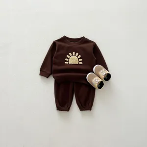 Brown baby sweatshirt pants set with cute sun embroidery and matching casual toddler shoes detail