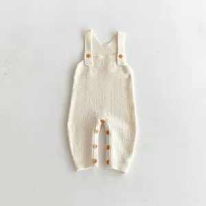 Knitted baby romper with wooden buttons, cute infant overalls for everyday casual wear.