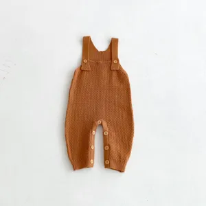 Infant knit romper product detail, brown baby overalls, soft cotton fabric, cute baby clothing.
