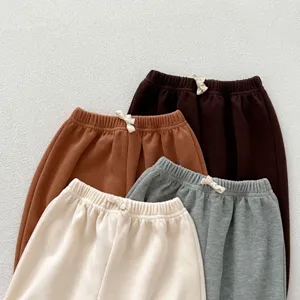 Detailed view of kids ribbed casual pants, soft fabric with elastic waist and cute bow.