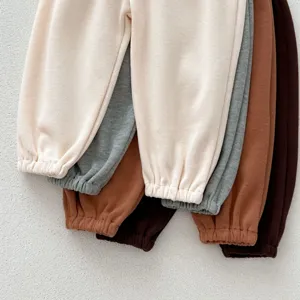 Ribbed casual children pants detail view, soft cotton blend material with elastic cuffs in multi colors.